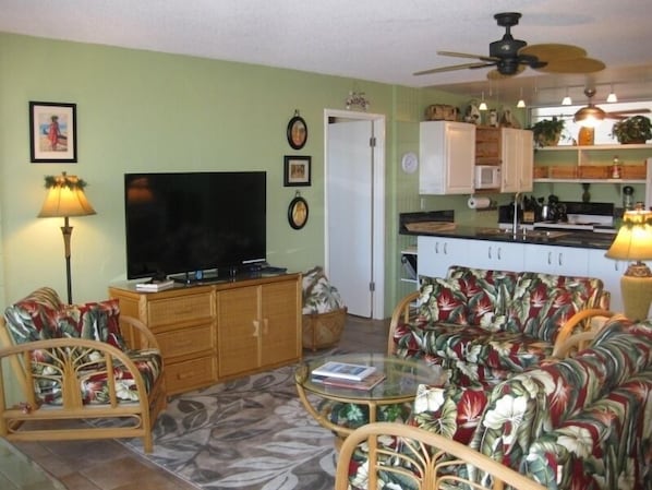 Open floor plan with new 55-inch Smart TV and newly upholstered furniture.