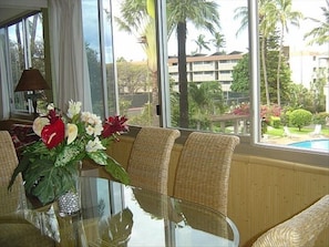 Dining table seats 6.  The large windows have a view of the pool and gardens.