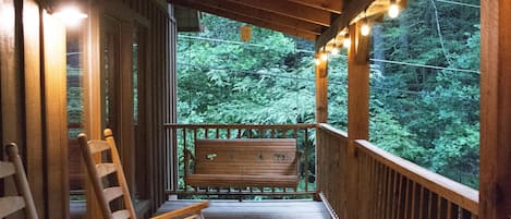 Porch wraps around 2 sides of the chalet.  Hot tub is located on the side porch.