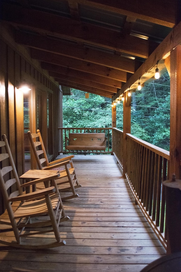 Porch wraps around 2 sides of the chalet.  Hot tub is located on the side porch.