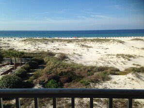 Beach and Gulf view from our balcony; watch the sunrise and set!