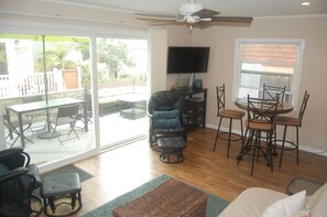Family room with large sliding glass door that opens to front patio.