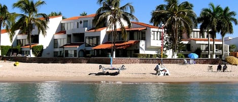 Beachfront view of 2 story condo in center of picture.