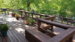 upper deck with gas grill and bench seats