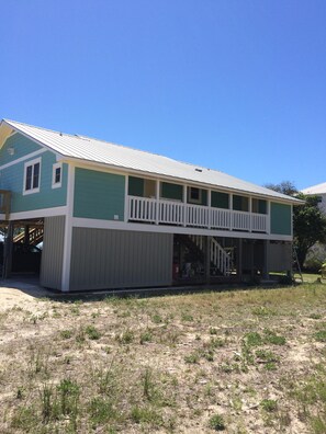 Back of house-park under the house when arriving at BEAUTIFUL Pelican Pass
