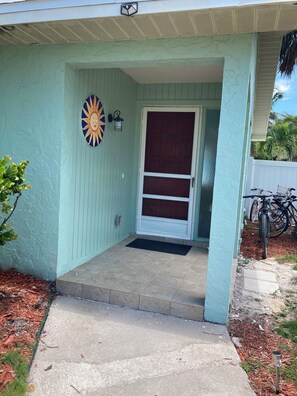 Front door. Next to door is a lock box for the key.