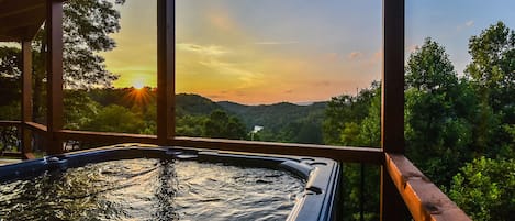 Soak your cares in the 6-person hot tub while overlooking the Toccoa River