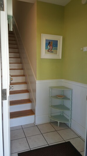 Front door entrance with steps leading to main floor.