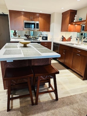 Counter top , enjoy dining on the island with Matt Setting and stool