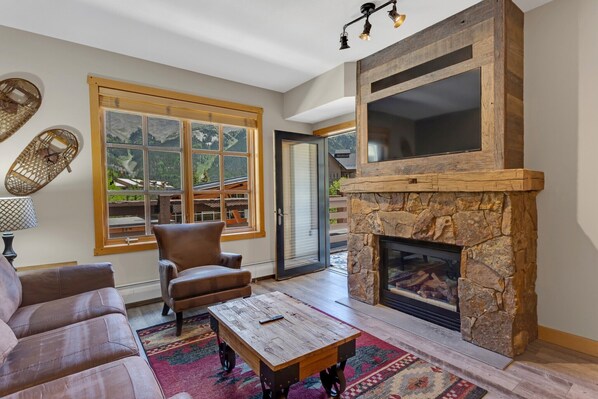 Fireplace with reclaimed barn wood and built-in TV