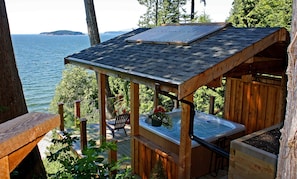 Cozy west-coast cedar pavilion overlooks the ocean.