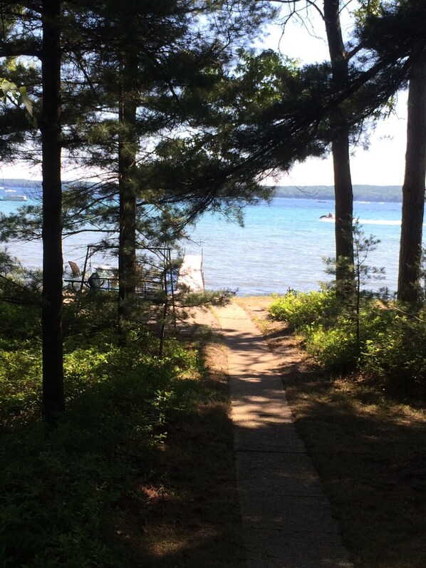 Sidewalk path just outside front door to patio and beach.