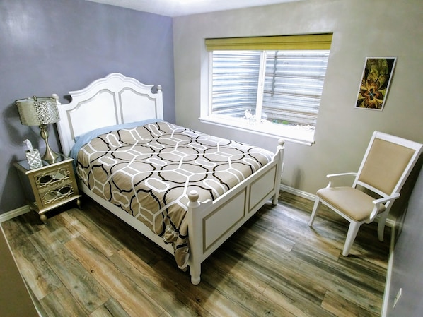 1st Bedroom with Queen size bed, huge window, and plenty of closet space.