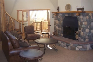 Spacious main living room with kitchen bar, dining room and deck. Beautiful