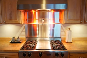 Gas stove, griddle, and warming racks