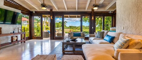 Wonderfully cozy living room with amazing garden and ocean views!