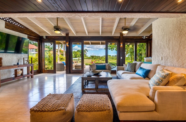 Wonderfully cozy living room with amazing garden and ocean views!