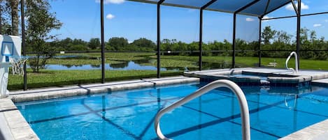 Pool overlooking lake and conservation area