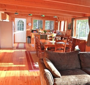 View of Kitchen and Dining room from the living room. The Bay is to the right.