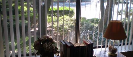 Master Bedroom view (South by Southwest) the tennis courts and the relaxing oaks