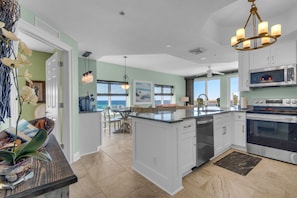 Kitchen with views into living area.  2nd Bedroom Suite is door on the left.