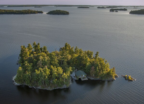 Aerial view of the island. The cabin is hidden in the trees on the right.