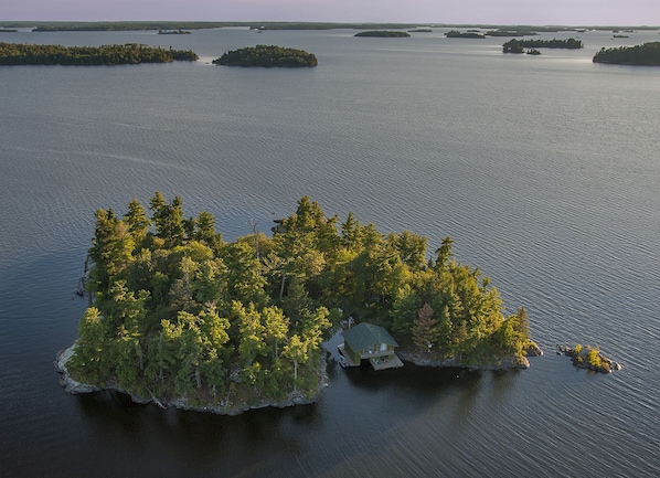 Aerial view of the island. The cabin is hidden in the trees on the right.