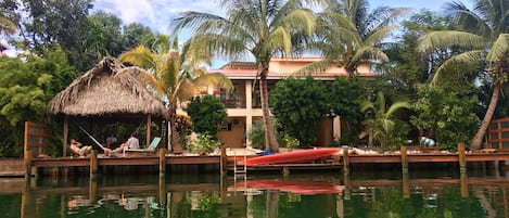 View of house, dock and palapa from private canal.