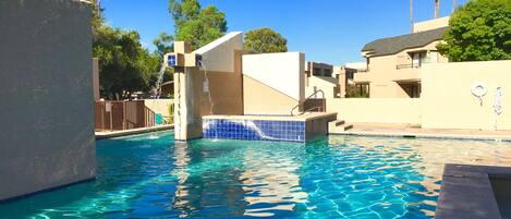 Gorgeous pool with jacuzzi area is waiting for you.