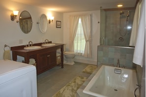 Downstairs bathroom with walk-in shower and soaker tub. Laundry located here.