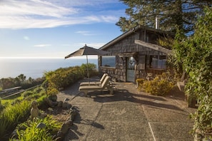 The stone path & patio that leads to The Gallery House on our Big Sur property