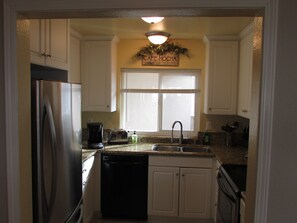 kitchen with granite tops, fully stocked