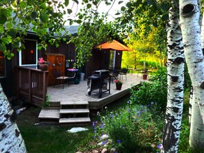 Private shaded back deck with BBQ & access to BIG fenced yard.