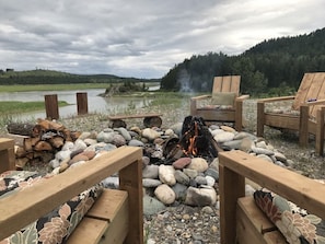 Enjoy evening around large wood fire pit on the bluff with spectacular views