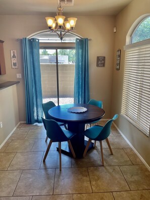 Open concept includes a dining space with big windows for natural light