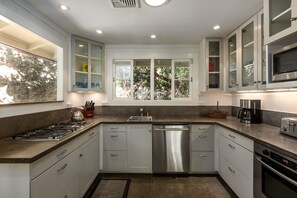 Full view of equipped kitchen with appliances and all necessary utensils