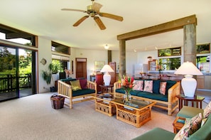 Jasmine Suite living room with kitchen in the backround