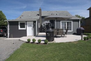 Back patio with 2 sitting areas, BBQ and fire pit