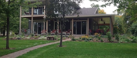 Wrap around porch with a view of the Ottertail River and lake.