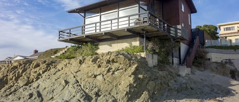 This iconic oceanfront cayucos beach home sits directly over the sand 