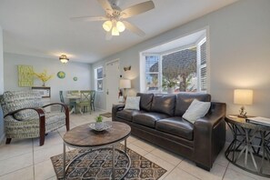 Bright and cheery living room with queen size pullout sofa