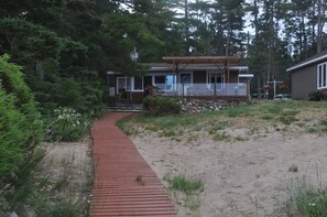 View from beach up walkway to cottage