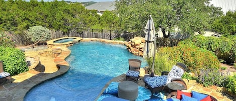 Private backyard pool
With hot tub