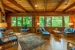 Living room has lake views and plenty of room. Old TV was replaced. 