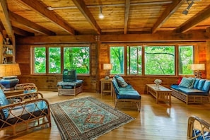 Living room has lake views and plenty of room. Old TV was replaced.