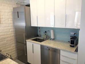 Elegant European kitchen
Cambria counters Top-shelf appliances