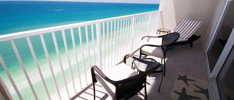 Balcony seating, views off of  LR and MBR,  1 Lounger, 2 chairs, side table