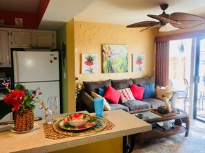 living room,  has sliding doors to lanai with ocean view.
