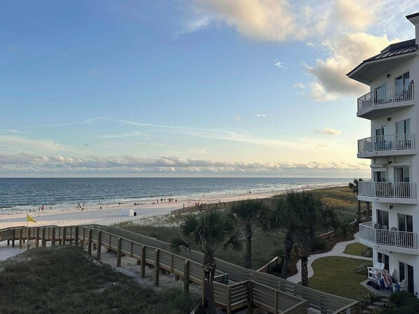 Looking over the new boardwalk to the beach from the balcony of the unit.