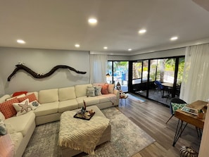 The living room overlooks the pool and lanai